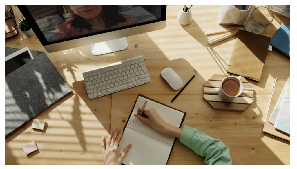 Woman writing on notepad